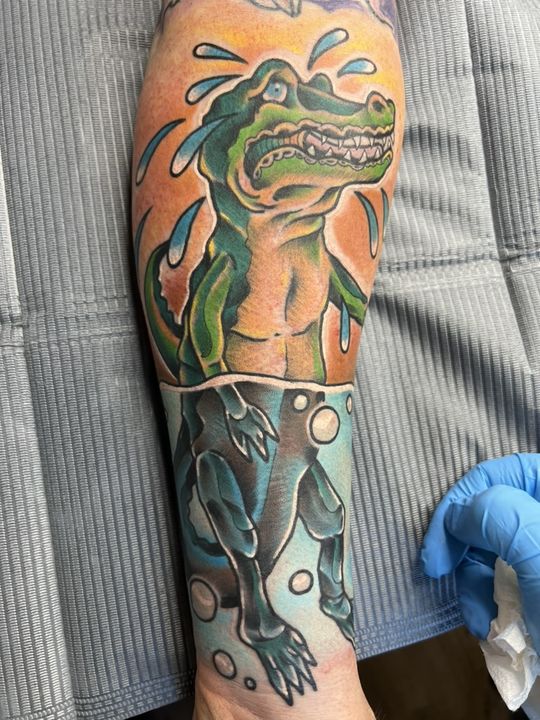 Crocodile tears, colour forearm — tattoo at Stingray Tattoo, Regina