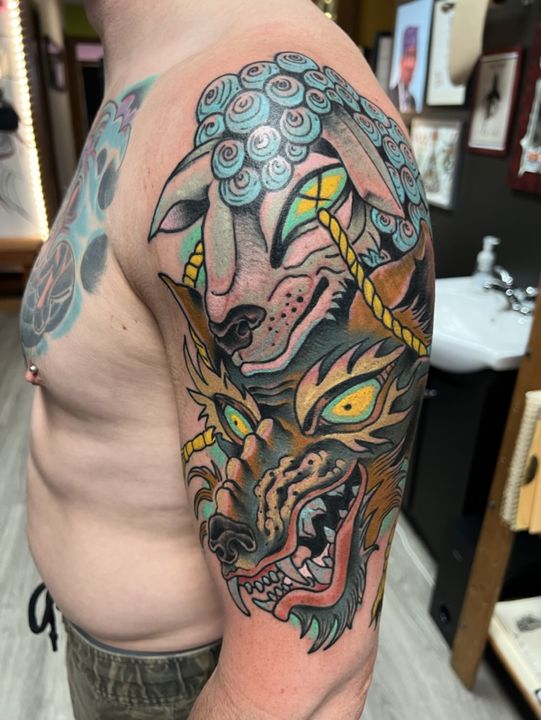 Wolf in sheep's clothing, colour shoulder piece — tattoo at Stingray Tattoo, Regina